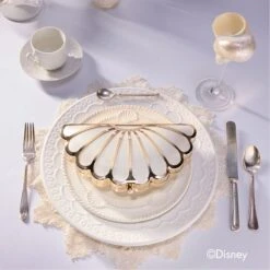 Aldo Arielclutch: Ariel-Inspired Shell-Shaped Clutch with Pearl Clasp 17 Aldo Arielclutch: Ariel-Inspired Shell-Shaped Clutch with Pearl Clasp -The Aldo Shop product 14009193 arielclutch multi 976 002 029 campaign part sq nt